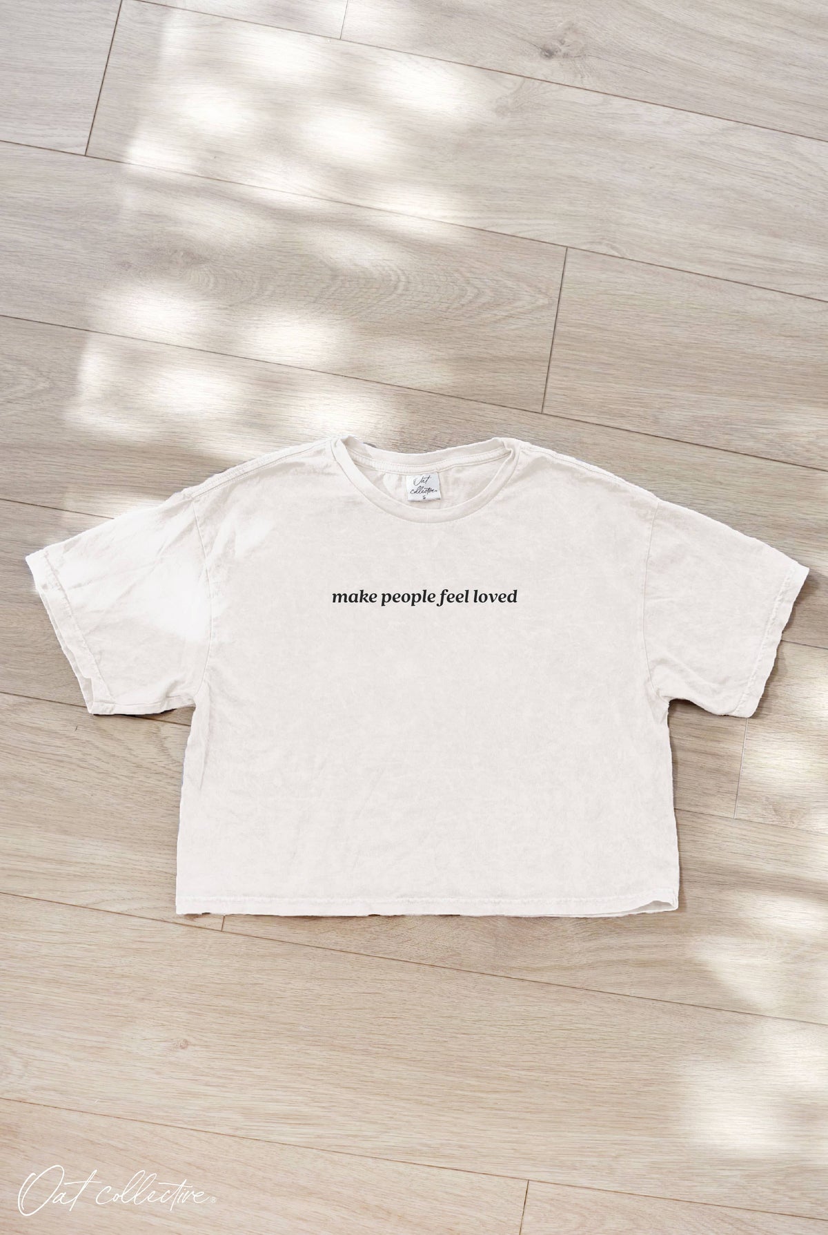 MAKE PEOPLE FEEL LOVED Cropped Mineral Graphic Top