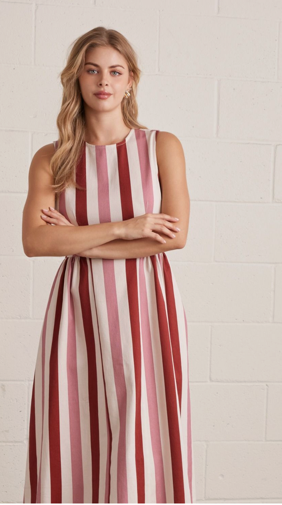 Rustic Combo striped sleeveless midi dress featuring back zipper closure. Side pockets. Unlined. Woven. Non-sheer. Lightweight.