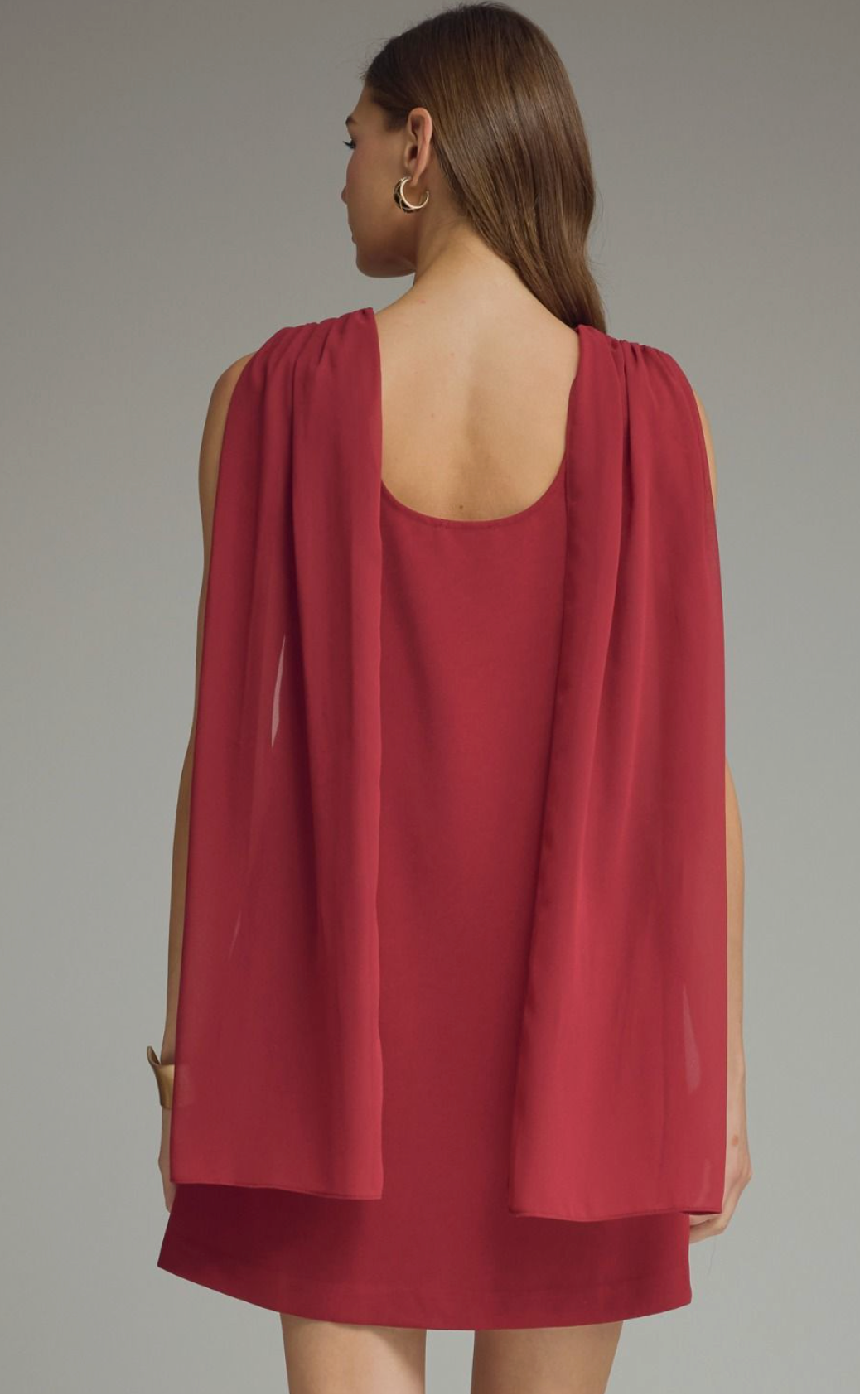 Solid sleeveless mini dress featuring draped cowl neckline with back scarf panel. Side zipper closure. Pocket at side. Lined. Woven. Non-sheer. Lightweight.