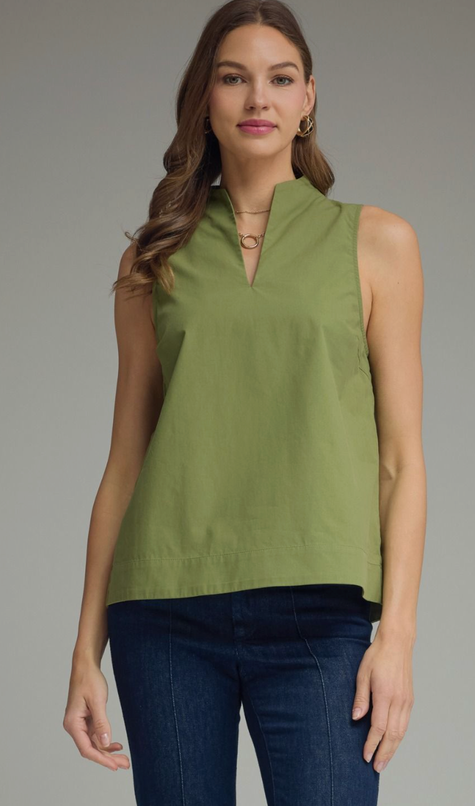 Solid sleeveless top featuring split V-neck with stand collar. Unlined. Woven. Non-sheer. Lightweight.