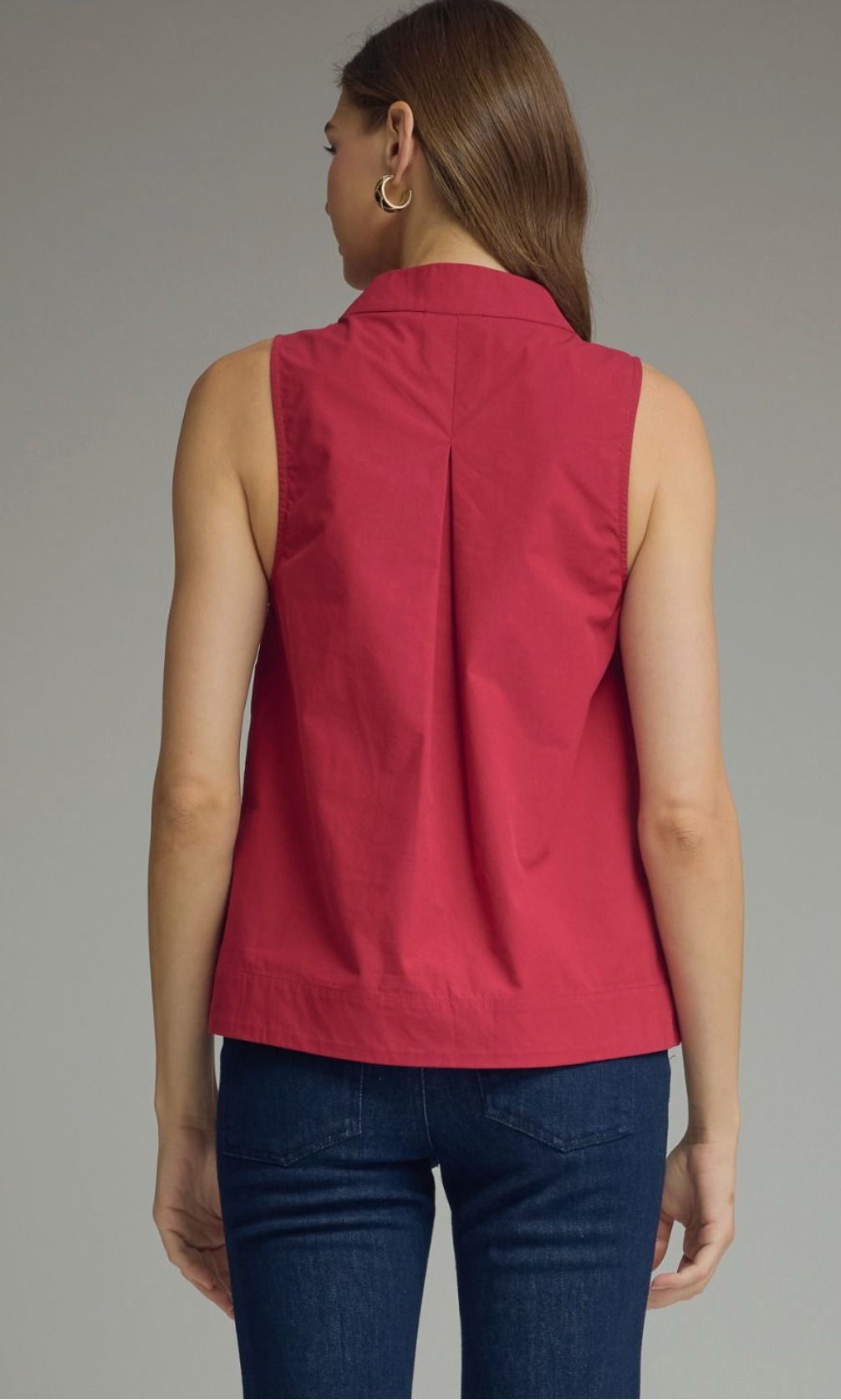 Solid sleeveless top featuring split V-neck with stand collar. Unlined. Woven. Non-sheer. Lightweight.