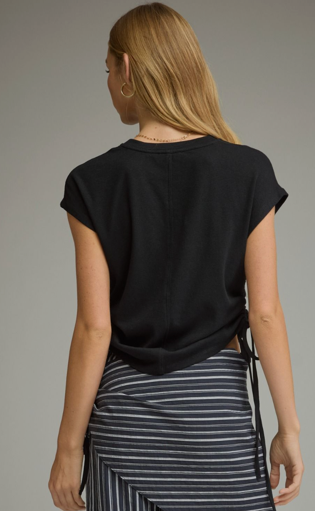 Solid knit cap sleeve top featuring side drawstring ties.